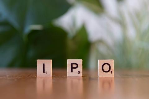 A wooden block spelling the word ipo on a table by Markus Winkler courtesy of Unsplash.