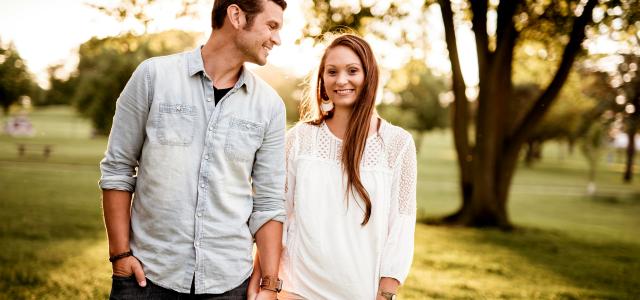 man holding hand of woman standing near tree by Ben White courtesy of Unsplash.